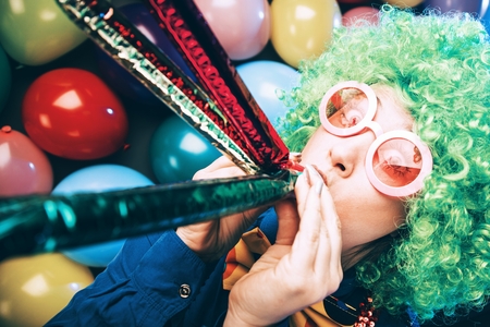 Portrait of beautiful party woman in wig and glasses Carnevalの写真素材