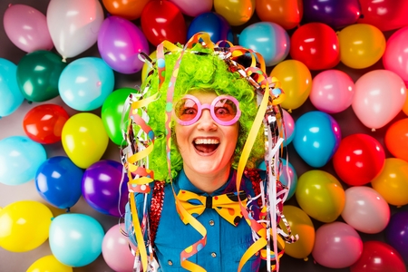Portrait of beautiful party woman in wig and glasses Carnevalの写真素材