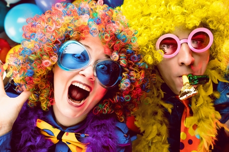Women and men celebrating at party for new years eve or carnivalの写真素材