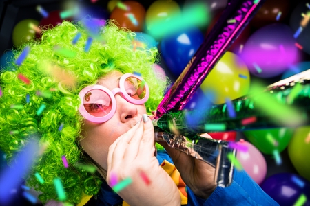 Portrait of beautiful party woman in wig and glasses Carnevalの写真素材
