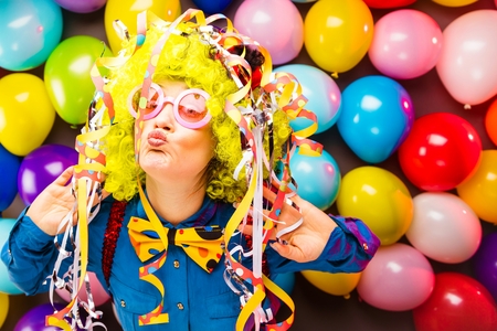 Portrait of beautiful party woman in wig and glasses Carnevalの写真素材