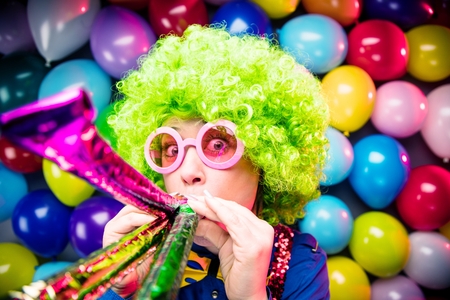 Portrait of beautiful party woman in wig and glasses Carnevalの写真素材