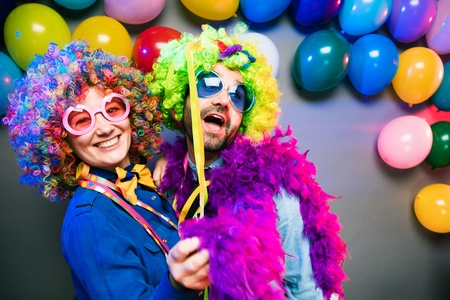 Women and men celebrating at party for new years eve or carnivalの写真素材