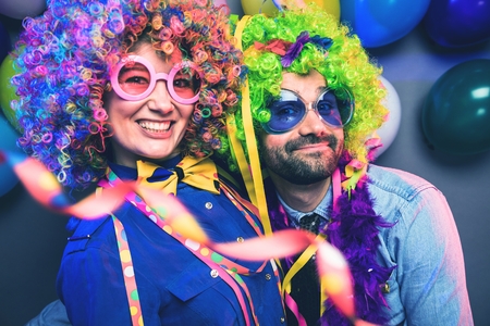 Women and men celebrating at party for new years eve or carnivalの写真素材