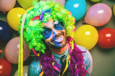 Happy Funny man at carnival Party dancing manの写真素材