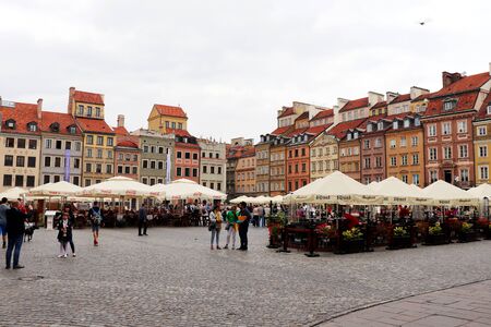 Old Town Square in Warsaw, Poland set up with booths and vendors on a nice summer day in July with people shopping.のeditorial素材