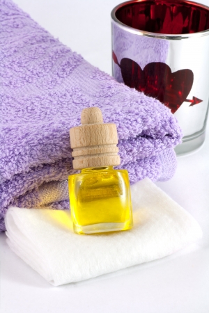 Aromatic pleasure  Fragrance oil, violet towel  Close up の写真素材