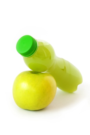 A fresh apple and a bottle of apple juice  On white background の写真素材
