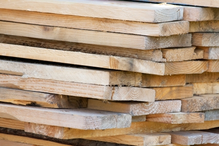 Texture of old wooden planks stacked pile for backgroundの写真素材