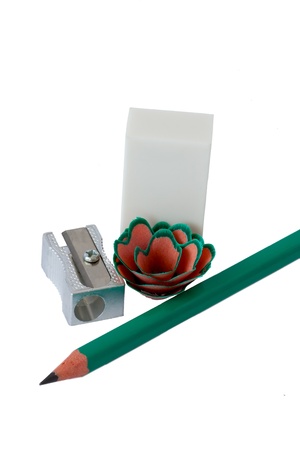 Green pencil, white eraser and metal sharpener  Isolation on white の写真素材