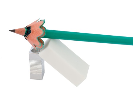 Green pencil, white eraser and metal sharpener  Isolation on white の写真素材