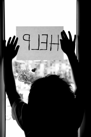 Domestic and family violence  Little girl asking for help の写真素材