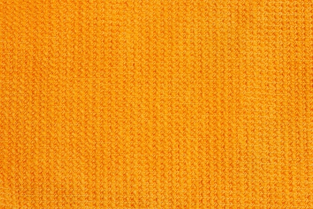 Abstract background. Orange micro fiber cloth. Close up.の写真素材