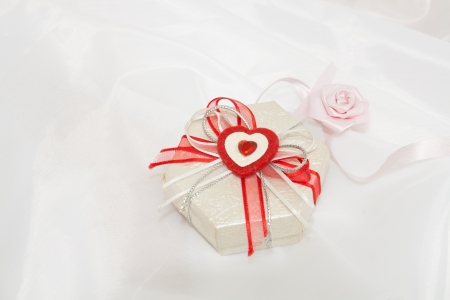 Gifts for the beloved  White satin background の写真素材