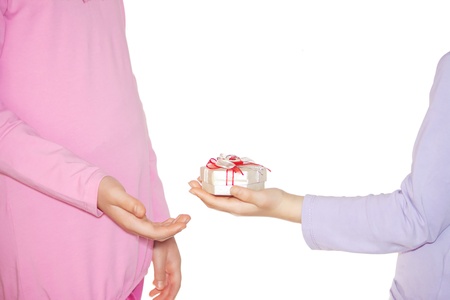 Young girl giving present box to her sister  Isolated on white background の写真素材
