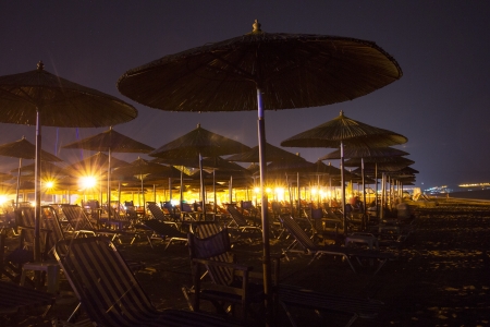 Empty beach at night  Lights in the background  New Vrasna, Greeceの写真素材