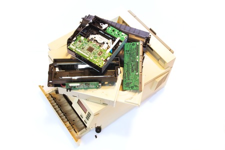 Electrical and electronic waste. Old computer parts on white .