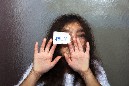 Domestic and Family Violence. Little Girl Asking for Help. Look Through the Glass.