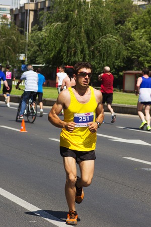 SKOPJE - MAY, 11: Unidentified runners on the street during Skopje Marathon on May 11, 2014 in Skopje, Macedoniaのeditorial素材