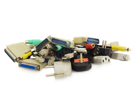 Old Connecting Cables and Adapters on White .