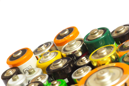 Group of Old AA, AAA and C Batteries in Closeup on White. Selective Focus.の写真素材