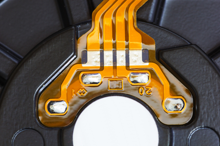 Close Up Texture of Integrated Circuit from a Hard Disk Drive. Computer Hardware Background.