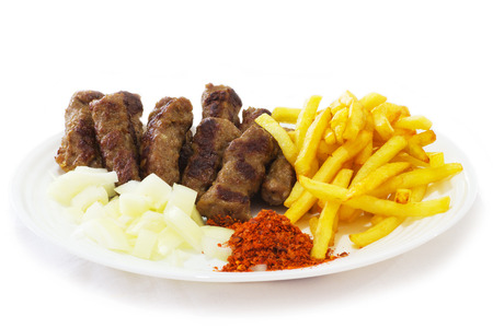 Cevapi - Traditional Food of the Balkans. Minced Meat Cooked on the Barbecue with Fresh Onion.の写真素材