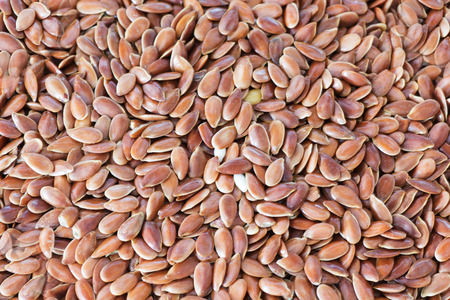 Closeup of Organic and Raw Flax Seed. Organic Food Background.