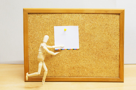 Wooden Figure Doll with Blank Cork Board. Image is Retro Filtered.の写真素材