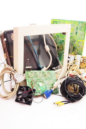 Old broken monitor and old computer parts. Electrical and electronic waste.の写真素材