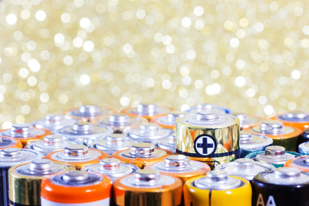 Group of old used batteries for recycling in different size. Selective focus.