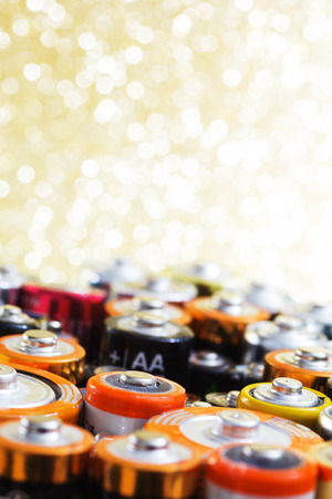 Group of old used batteries for recycling in different size. Selective focus.の写真素材