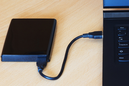 External Hdd drives 2.5 inch connected to laptop computer by USB cable.の写真素材