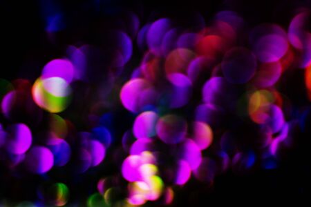 Abstract and festive background with blurred circles. De focused blurred lights.