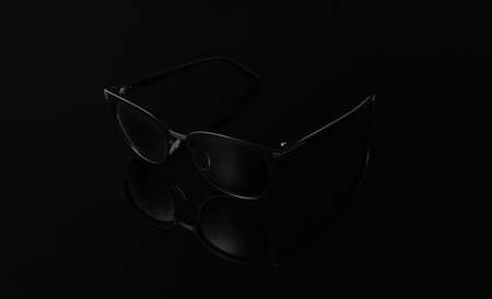 Black sunglasses on the black mirror backgroundの写真素材
