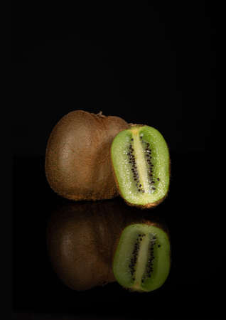 kiwi fruit on a black backgroundの写真素材