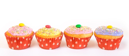 A row with cupcake muffins with red paper