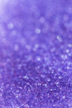 Purple sugar sparkle background with focus in the frontの写真素材