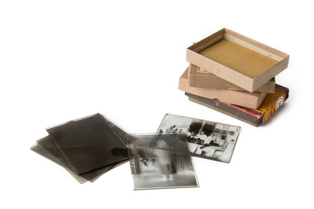 Old glass plate negative with cardboard box on white backgroundの写真素材