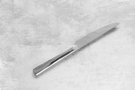 Knife on a concrete tableの写真素材