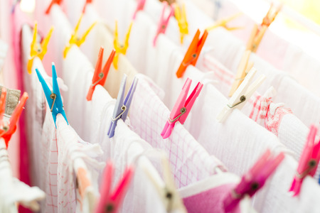 Colorful clothespin with kitchen towels drying outside