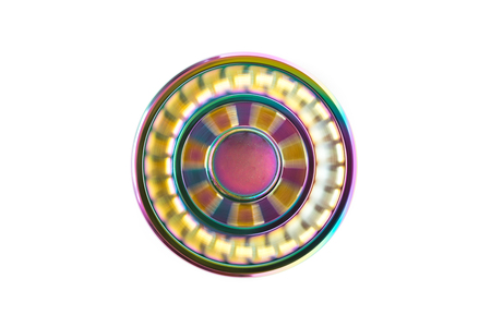 Hand spinner. A fidget toy for increased focus, stress relief on white backgroundの写真素材