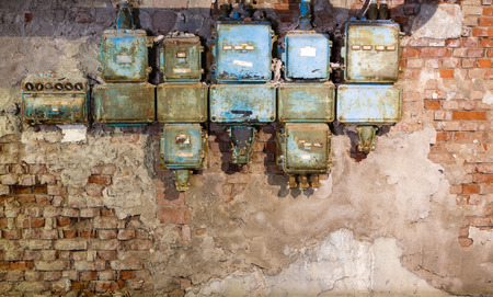Old fuse boxes in an old abandoned factoryの写真素材