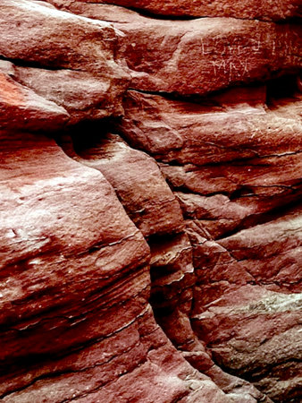Red sandstone rock wall texture background. Red sandstone texture backgroundの写真素材