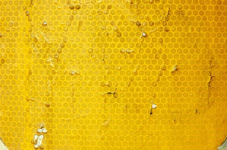 Closeup of aged yellow reflector tapeの写真素材