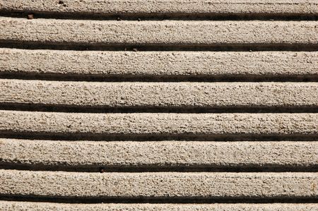 Closeup of lines pressed into a concrete sidewalkの写真素材