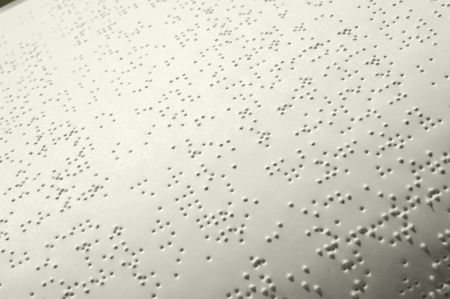 Closeup of a Bible written in Brailleの写真素材