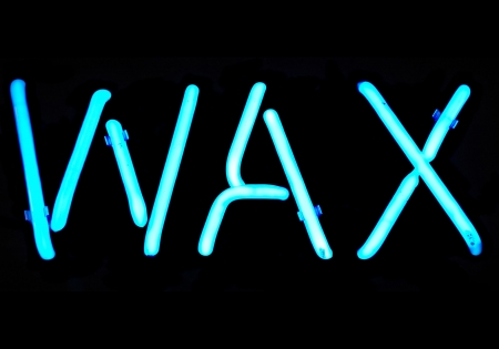 Blue neon sign with the word "Wax"の写真素材