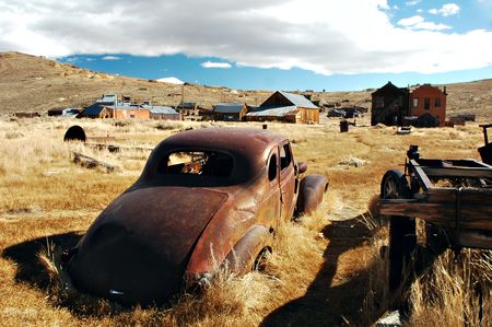 An abandoned car in the ghost town of Bodie, Californiaの写真素材