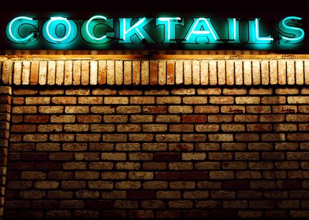 Cocktails neon sign above an old brick wall with copyspace availableの写真素材
